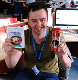 Mike Sheridan with his leaving presents - a student cookbook and a can of energy drink